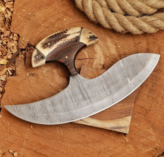 Decorative knife with wooden handle on a wooden surface