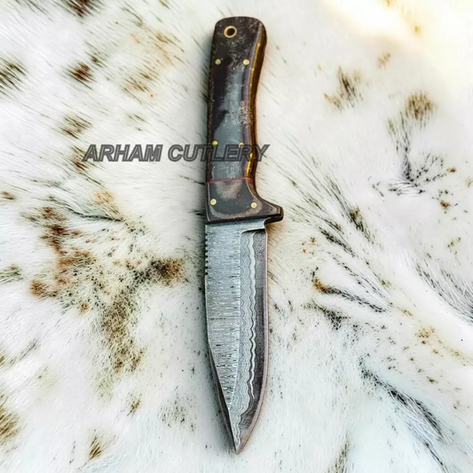 A fixed-blade knife with a Damascus steel blade and a dark wood handle, displayed vertically on a white fur background. The text 'ARHAM CUTLERY' is overlaid across the center.