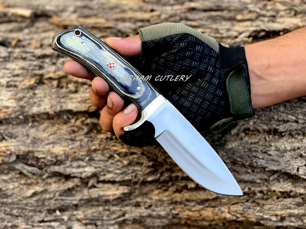 Handmade D2 steel hunting knife with brass guard and leather sheath by Arham Cutlery