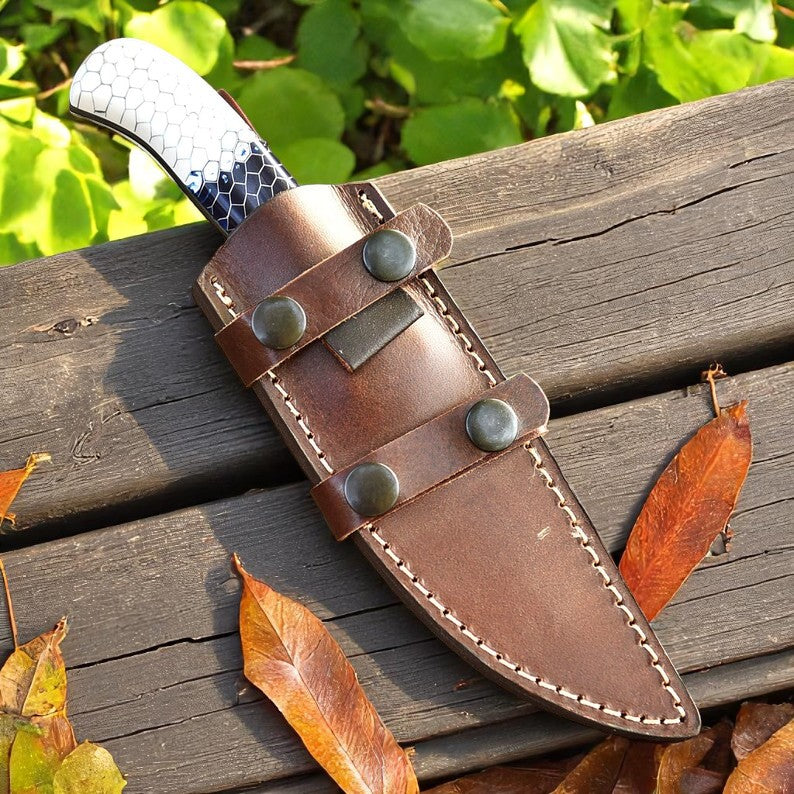Handcrafted D2 steel knife with colorful honeycomb resin handle held outdoors – Arham Cutlery