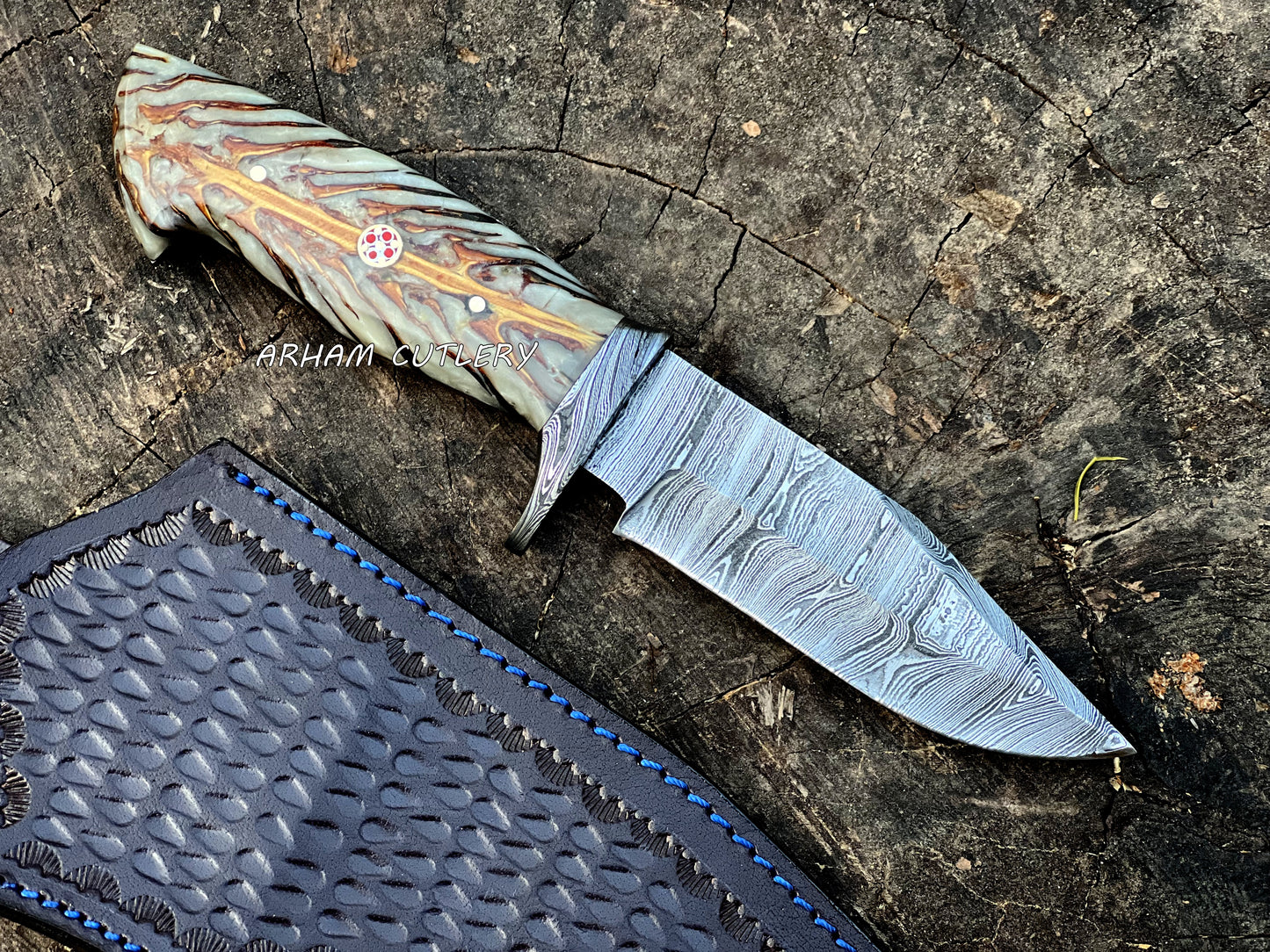 Handmade Damascus steel knife with pine cone resin handle and leather sheath by Arham Cutlery