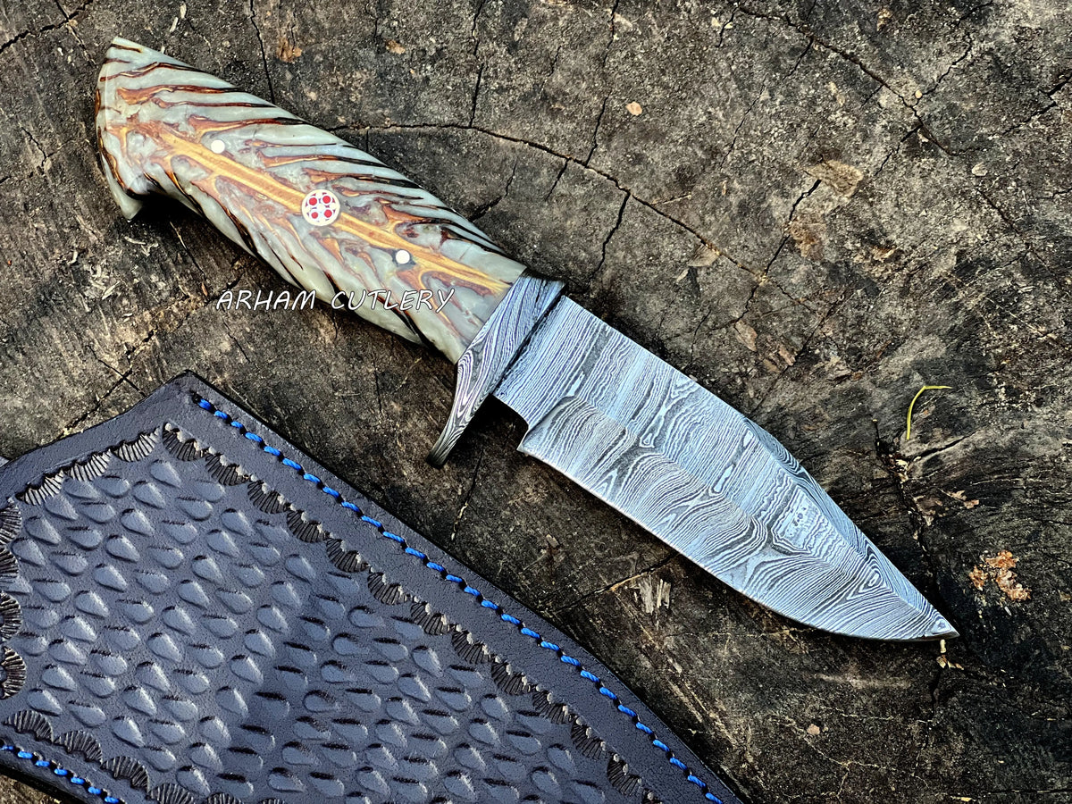 Handmade Damascus steel knife with pine cone resin handle and leather sheath by Arham Cutlery