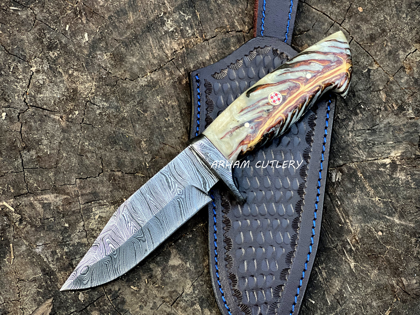 Handmade Damascus steel knife with pine cone resin handle and leather sheath by Arham Cutlery
