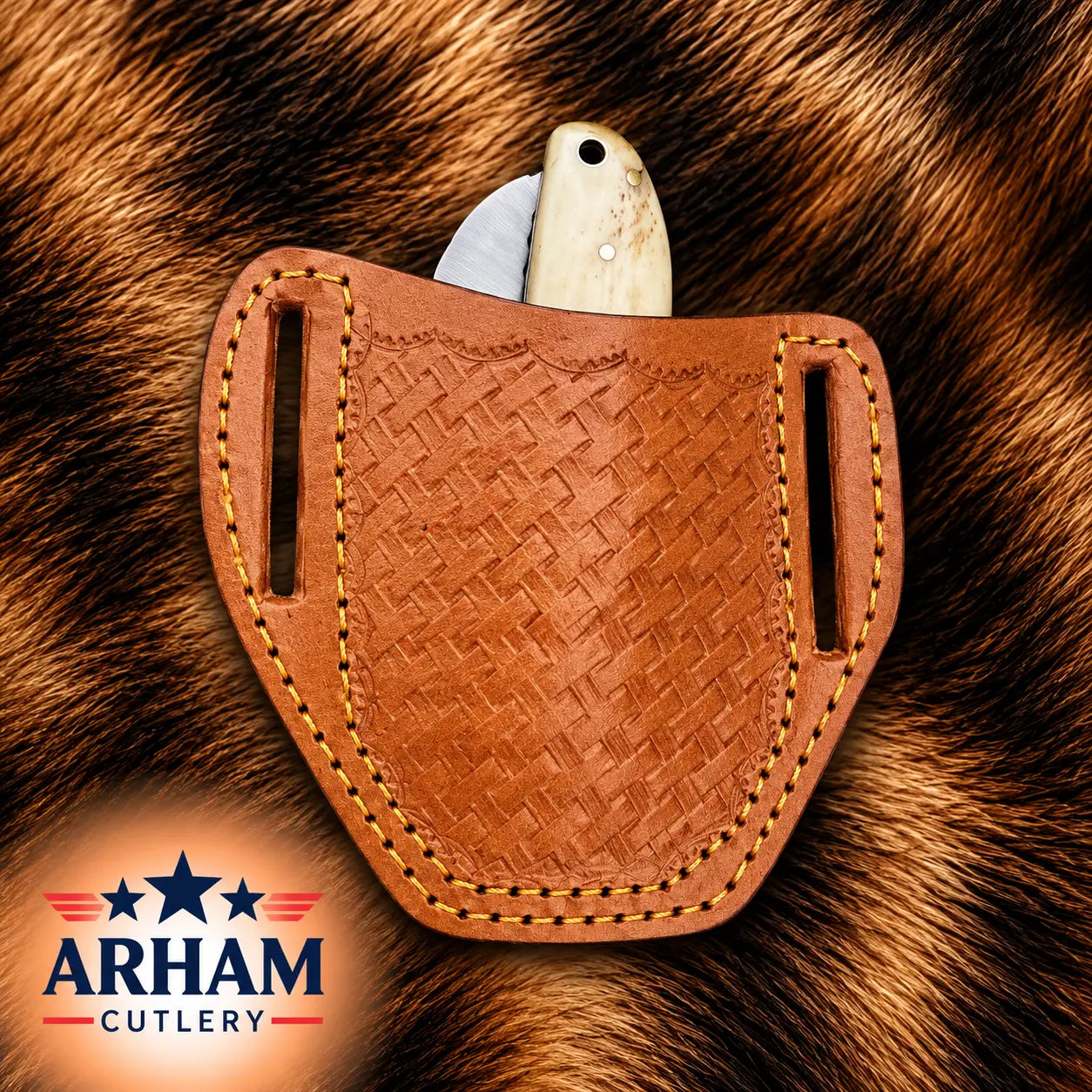 A brown leather knife sheath with a woven texture and contrast stitching, holding a knife with a light-colored handle, set against a brown fur background. The ARHAM CUTLERY logo is visible in the bottom-left corner.