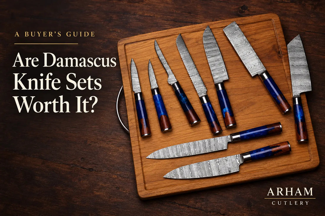 Nine-piece Damascus kitchen knife set with blue resin and wood handles on a wooden cutting board.