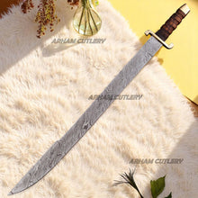 Cargar imagen en el visor de la galería, Hand-forged Damascus steel short sword with wooden handle and brass accents by Arham Cutlery, displayed on a wooden surface
