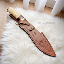 Cargar imagen en el visor de la galería, Handmade Damascus steel Bowie knife with bone and rosewood handle beside custom leather sheath – Arham Cutlery
