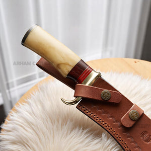 Handmade Damascus steel Bowie knife with bone and rosewood handle beside custom leather sheath – Arham Cutlery