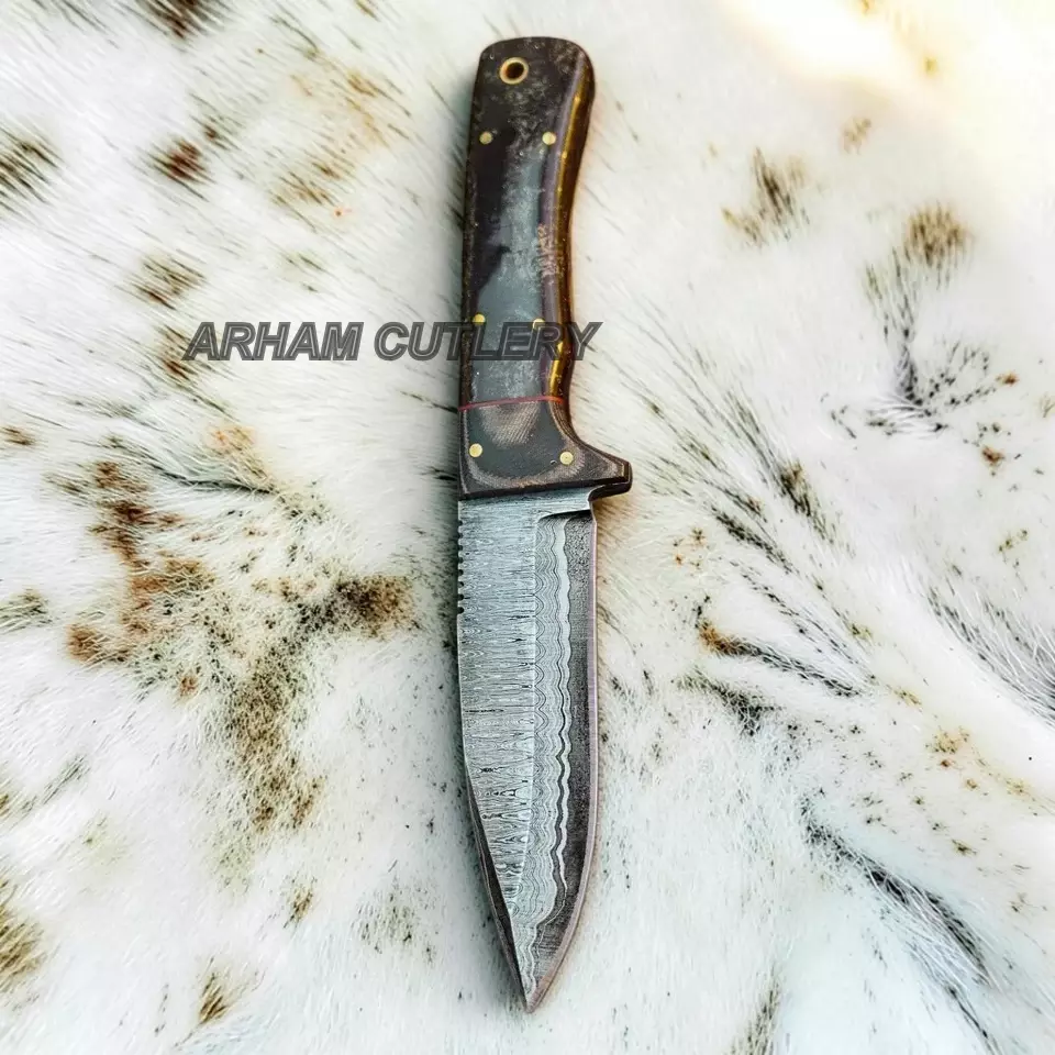 A fixed-blade knife with a Damascus steel blade and a dark wood handle, displayed vertically on a white fur background. The text 'ARHAM CUTLERY' is overlaid across the center.