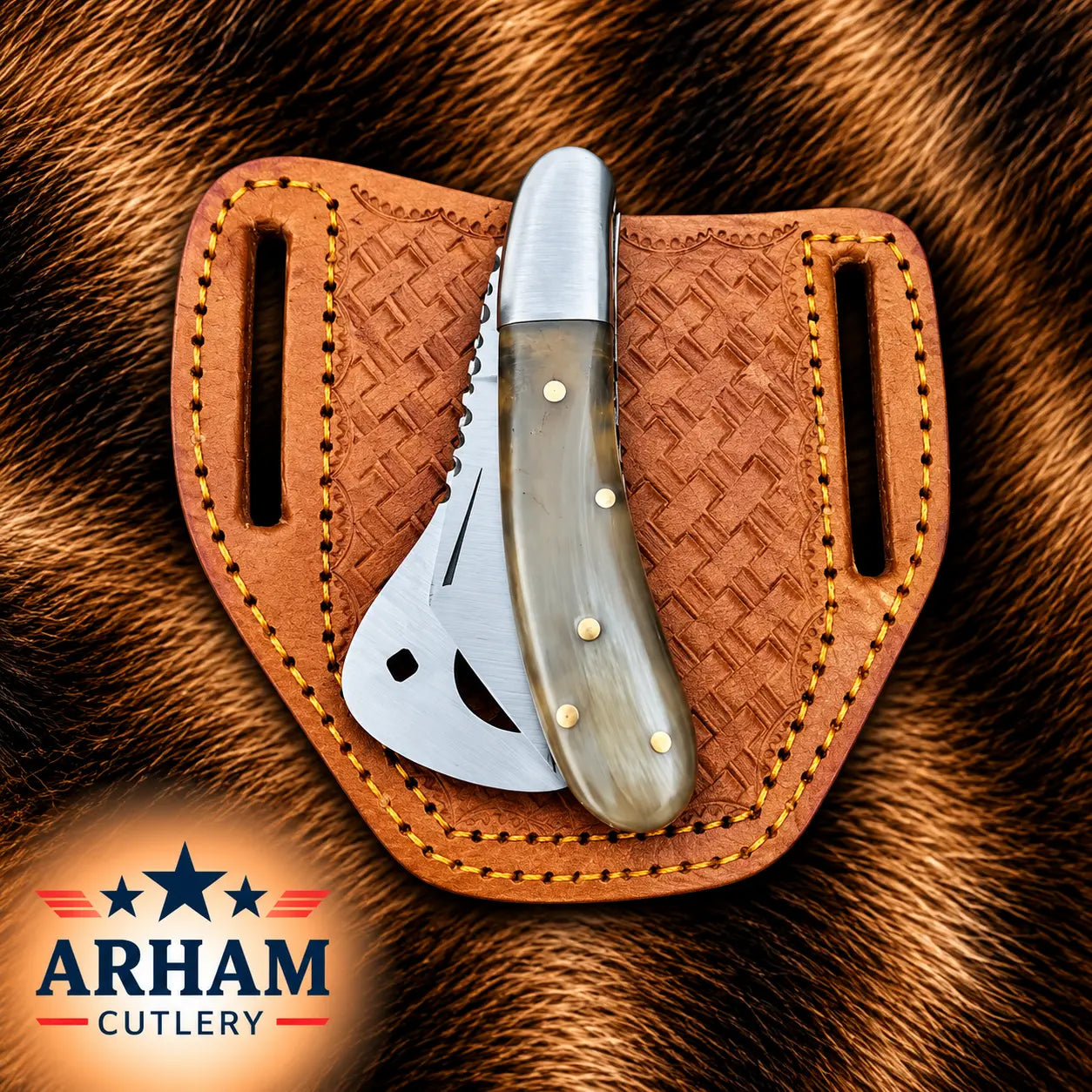 A folding knife with a polished steel blade and a curved bone handle rests inside a brown leather sheath with a woven texture, set against a brown fur background. The ARHAM CUTLERY logo is visible in the bottom-left corner.