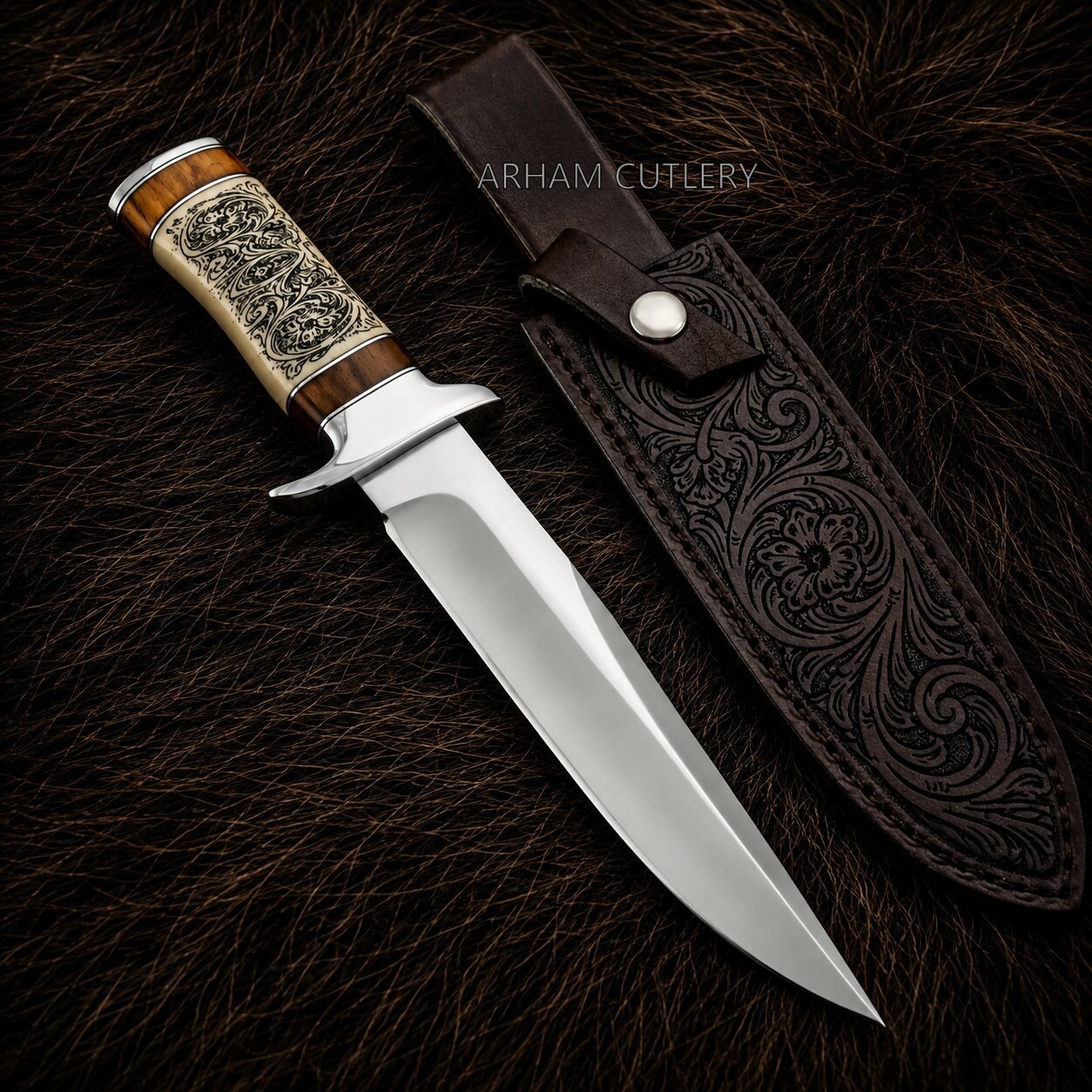 A fixed-blade knife with a polished silver blade, a carved wooden handle with silver engraved detailing, and a brown leather sheath, displayed on a dark brown fur background. The brand name 'ARHAM CUTLERY' is visible as a watermark.
