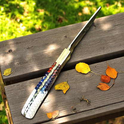 Handcrafted D2 steel knife with colorful honeycomb resin handle held outdoors – Arham Cutlery