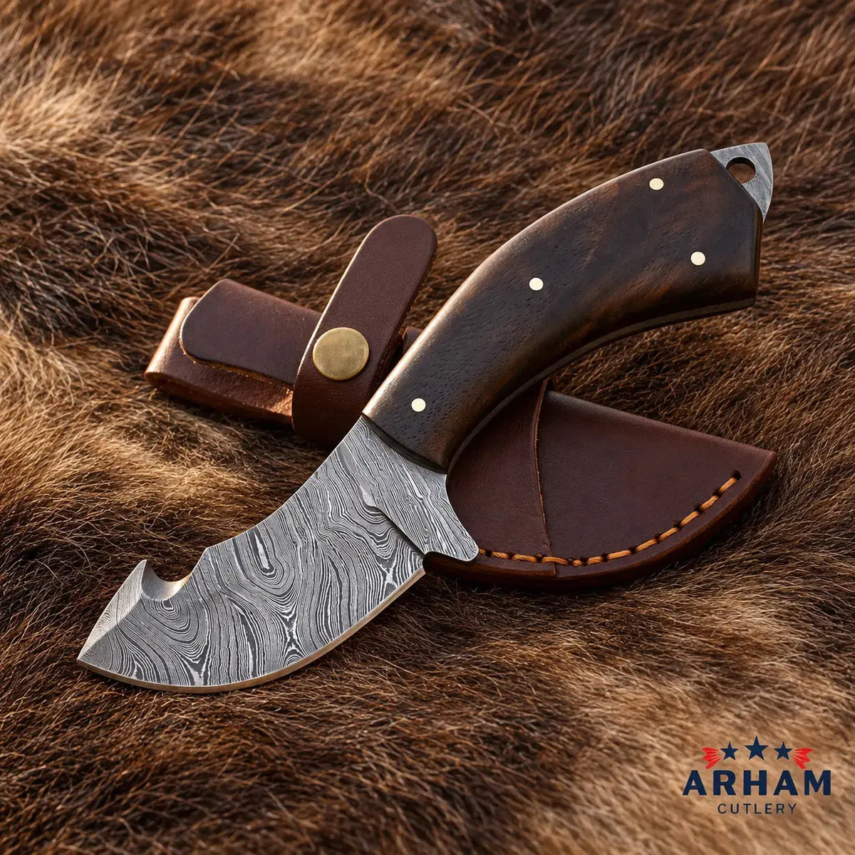 A fixed-blade knife with a patterned Damascus-style steel blade and a dark brown wooden handle, shown with a matching brown leather sheath on a brown fur background. The ARHAM CUTLERY logo appears in the bottom right corner.