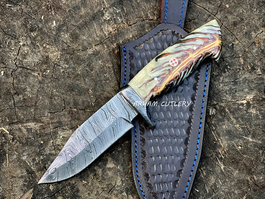 Handmade Damascus steel knife with pine cone resin handle and leather sheath by Arham Cutlery
