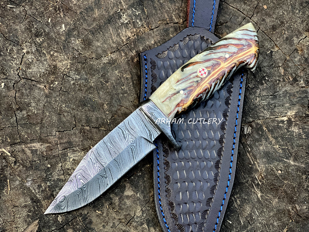 Handmade Damascus steel knife with pine cone resin handle and leather sheath by Arham Cutlery
