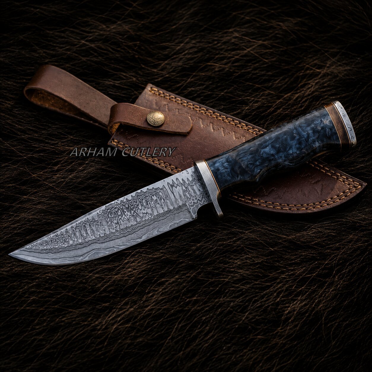A fixed-blade knife with a patterned steel blade and a dark blue marbled handle, displayed diagonally on a brown leather sheath over a dark brown fur background. A watermark reading 'ARHAM CULLERY' is visible across the center.