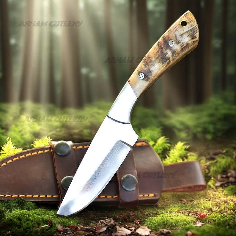 Handmade D2 steel hunting knife with ram horn handle, steel bolster, and leather sheath by Arham Cutlery