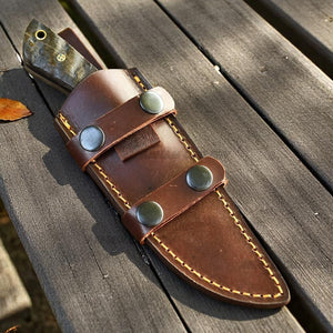 Handmade D2 steel hunting knife with ram horn handle, steel bolster, and leather sheath by Arham Cutlery