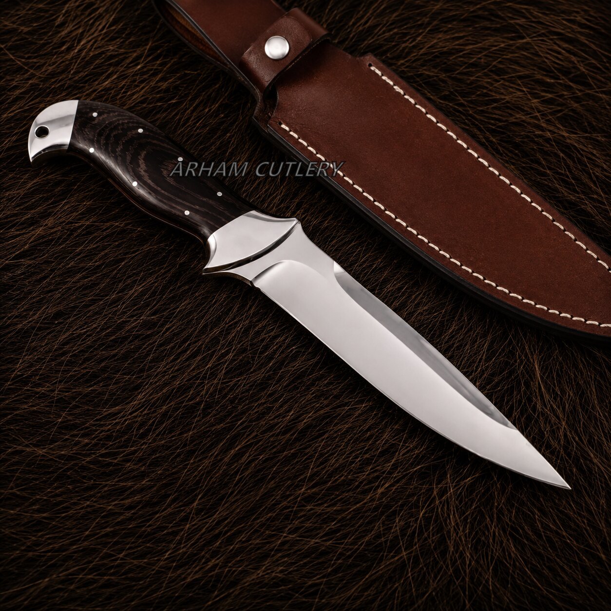 A fixed-blade knife with a polished silver blade, a dark wood handle, and a brown leather sheath, displayed on a dark brown textured fur background. The brand name 'ARHAM CUTLERY' is watermarked across the center.