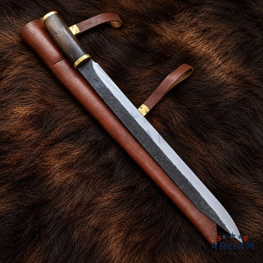 A long fixed-blade knife with a dark patterned steel blade, a brown leather sheath, and a dark wood handle with brass accents, laid diagonally on a brown fur background.