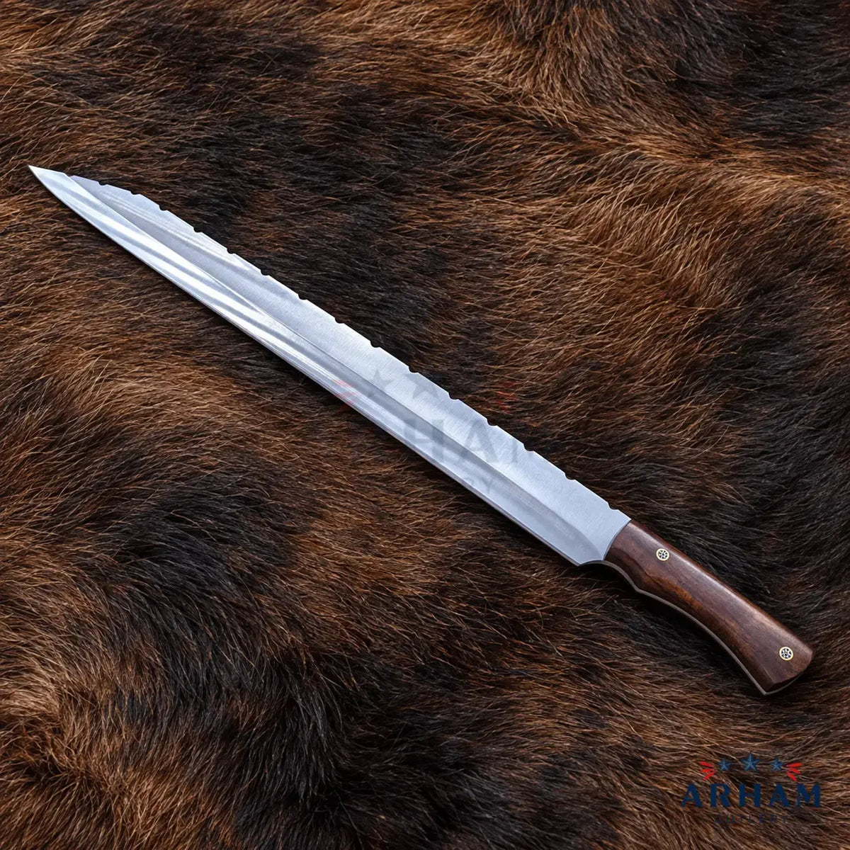 A long, serrated kitchen knife with a silver steel blade and a dark brown wooden handle, laid diagonally on a brown and black animal fur background.