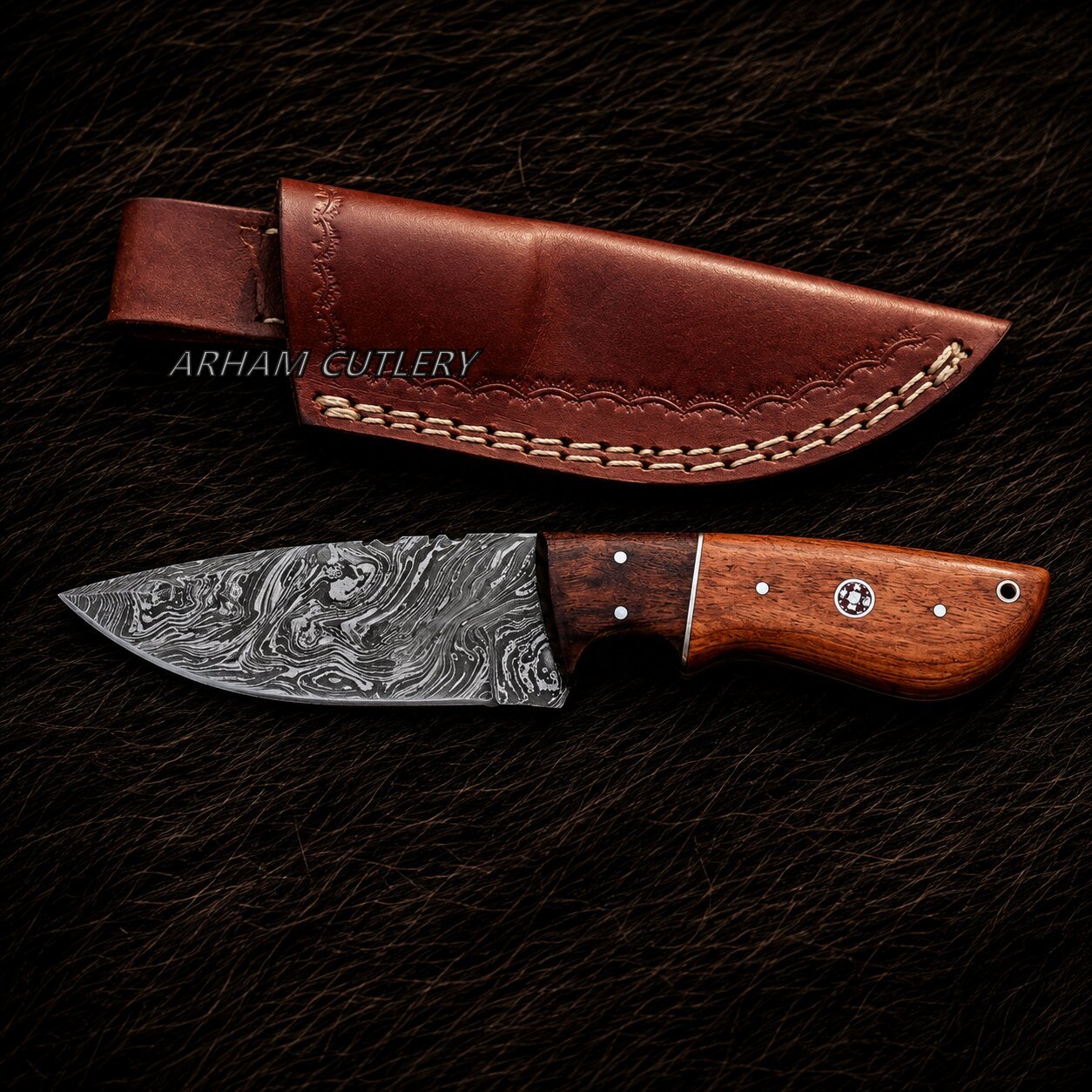 A Damascus steel fixed-blade knife with a patterned steel blade and a brown wooden handle, shown alongside its brown leather sheath on a dark textured background. The brand name 'ARHANI CUTLERY' is watermarked across the sheath.