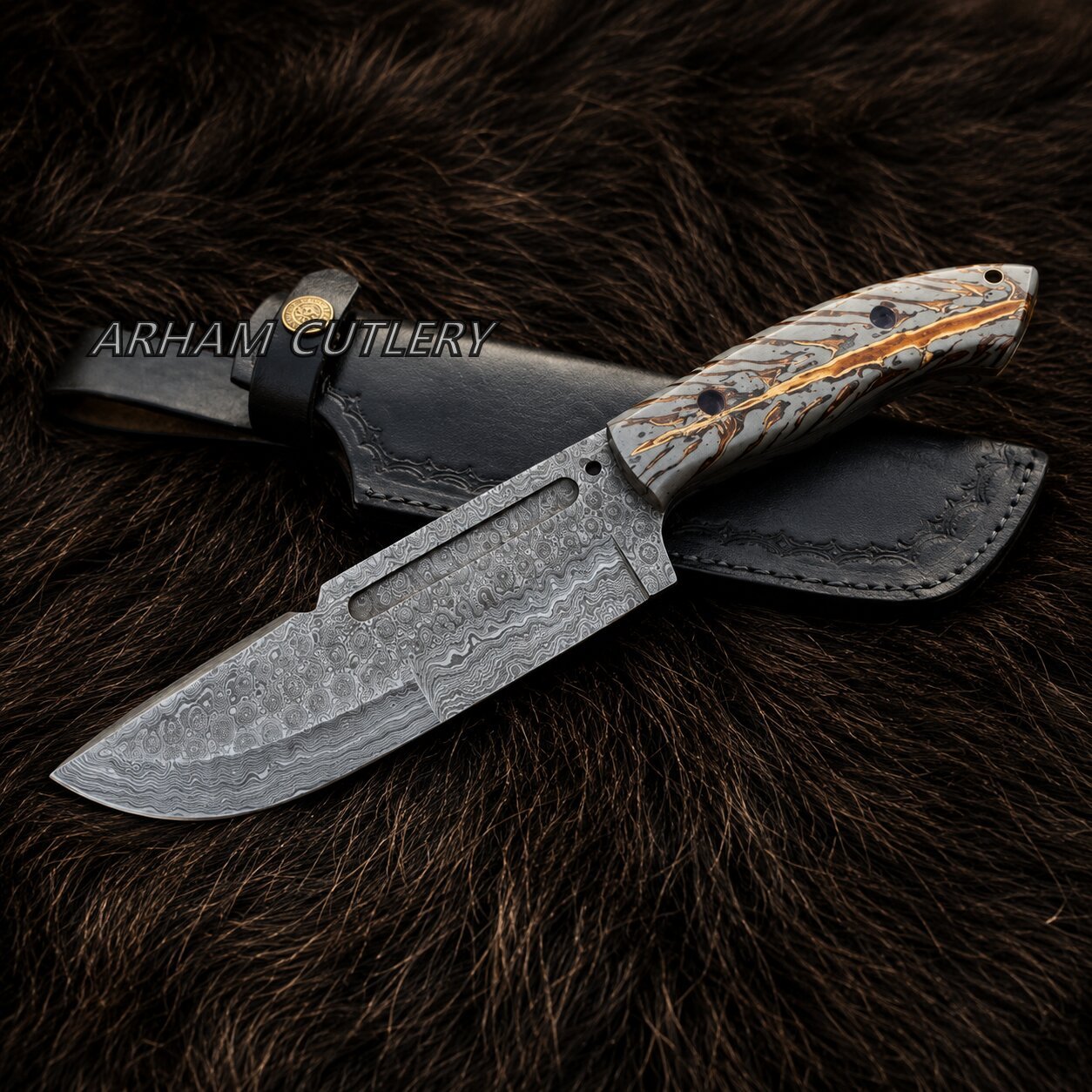 A fixed-blade knife with a patterned steel blade and a carved handle, shown with a black leather sheath on a dark brown fur background. The brand name 'ARHAM CUTLERY' is watermarked across the center.