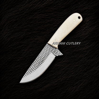 A fixed-blade knife with a textured, patterned silver blade and a cream-colored bone handle, displayed diagonally on a black textured background. The brand name 'ARHAM CUTLERY' is printed in white text over the handle.