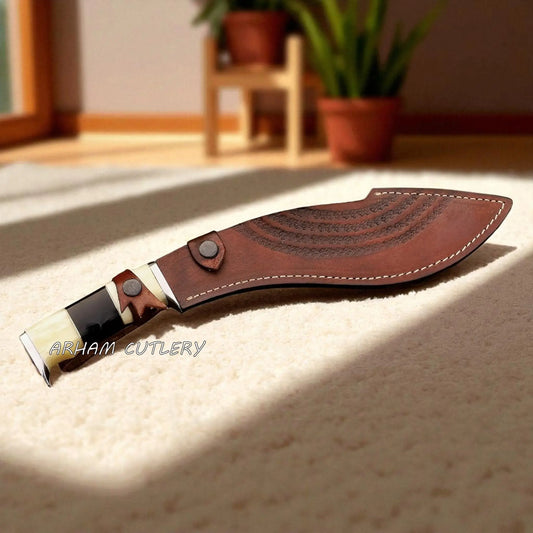 The Himalayan Talon handmade Kukri machete with stainless steel blade, bone and resin handle, and custom leather sheath by Arham Cutlery.