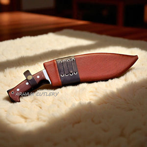 The Jungle Howl engraved Kukri machete with micarta handle and leather sheath, designed for bushcraft and outdoor use by Arham Cutlery.

