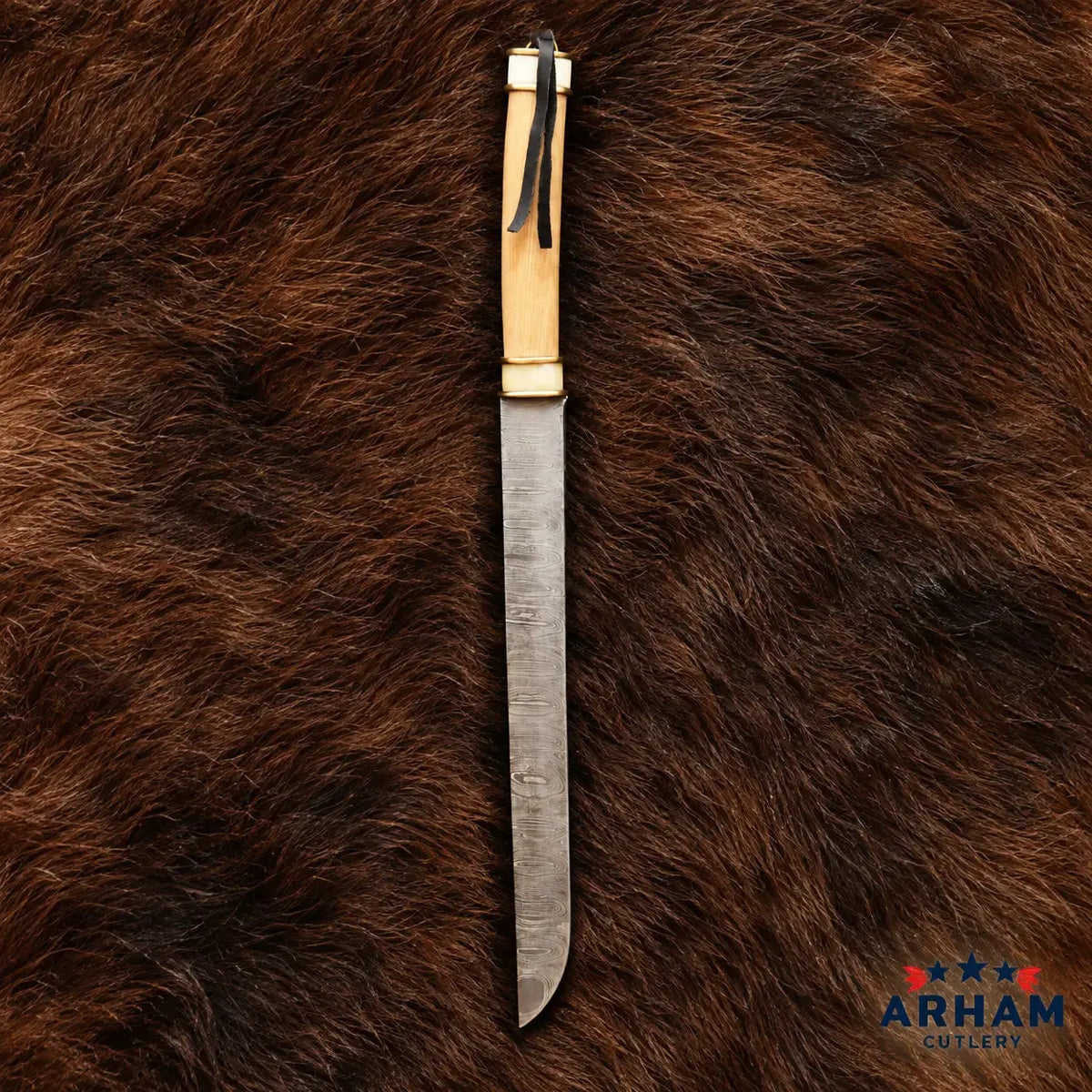 A fixed-blade knife with a textured steel blade and a light-colored wooden handle, displayed vertically on a brown fur background. The ARHAM Outfitter logo is visible in the bottom right corner.